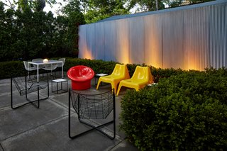 With ample seating and an illuminated landscape, the backyard can facilitate easy entertaining.