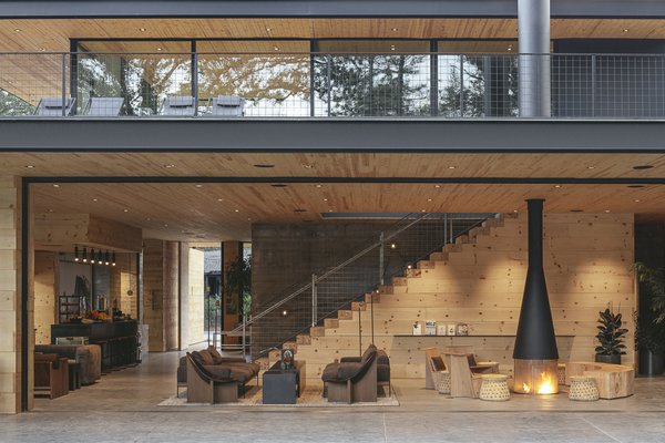 Heating and cooling are essential for Yosemite's snowy winters and broiling summers. Glass walls along all sides of the clubhouse fold away to let air in—or slide shut to insulate the space from the temperature outside.