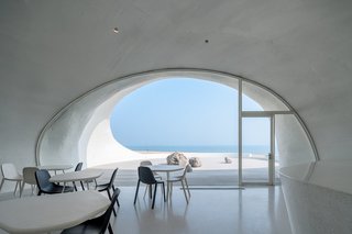 The cafe's tables, which were designed by the architect, match the floor plans of the different gallery spaces.