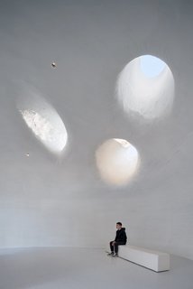 "Hidden between the sea and the sand, the museum emerges as a shelter, intimate to the body and soul—a place to thoughtfully contemplate both nature and art," explains the firm.