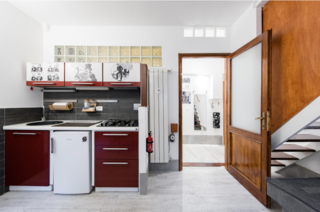 Take a stroll by the Trevi Fountain before retiring to this petite, modern apartment. The lofted bedroom and splashes of pop art turn the whimsy up to 11.