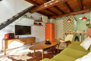 This colorful cottage (complete with garden, midcentury modern decor, and a spiral staircase) is located in the historical San Lorenzo neighborhood near Sapienza University. Bars, restaurants, and public transport abound in this bohemian locale.