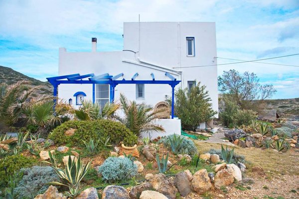 The mediterranean island is home to an array of succulents and chaparral. The white and blue buildings are a signature of the region.
