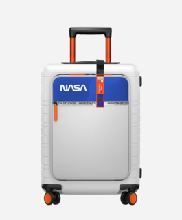 The redesigned, special-edition M5 cabin luggage is Apollo white with NASA's blue and orange trim. 