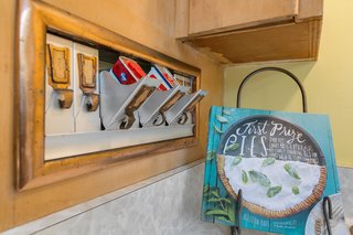 A built-in spice cabinet is yet another of the kitchen's many unique details.