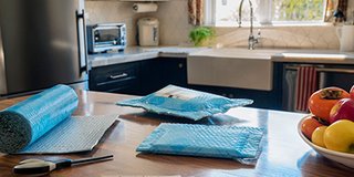 The sheet can be cut to size for the item being shipped, eliminating waste and creating a compact package. 