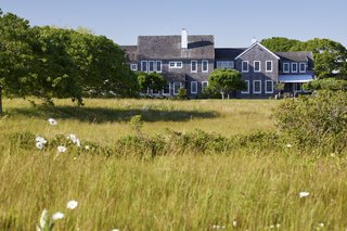 The rear of the home overlooks an expansive natural landscape. Views of the ocean can be taken in from almost every room in the house.