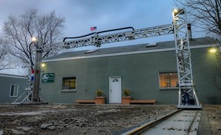 A before photo shows the job site where printing took place. The metal scaffolding is part of SQ3D’s patent-pending ARCS technology, which took years to develop.