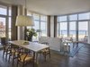 Suites include a spacious living and dining area, a full second bathroom, and a small, fully accessorized kitchen. Photo 3 of Asbury Ocean Club Hotel modern home