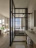 The showers are enclosed in glass to bring in natural light and give the feeling of showering outdoors. But not to worry—there are drapes for privacy when needed. Photo 9 of Asbury Ocean Club Hotel modern home