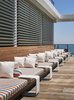 A 55-foot nautical-themed sofa runs along one side of the pool deck. Photo 11 of Asbury Ocean Club Hotel modern home