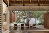 Jaque Studio didn't want the pool area to be crowded with beach chairs reminiscent of a resort. Instead, there is this petite relaxation zone. Photo 5 of Jungle Keva Tulum modern home