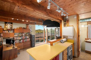 The home also offers a large office and craft space. Large sliding doors and windows brighten the space with natural light.