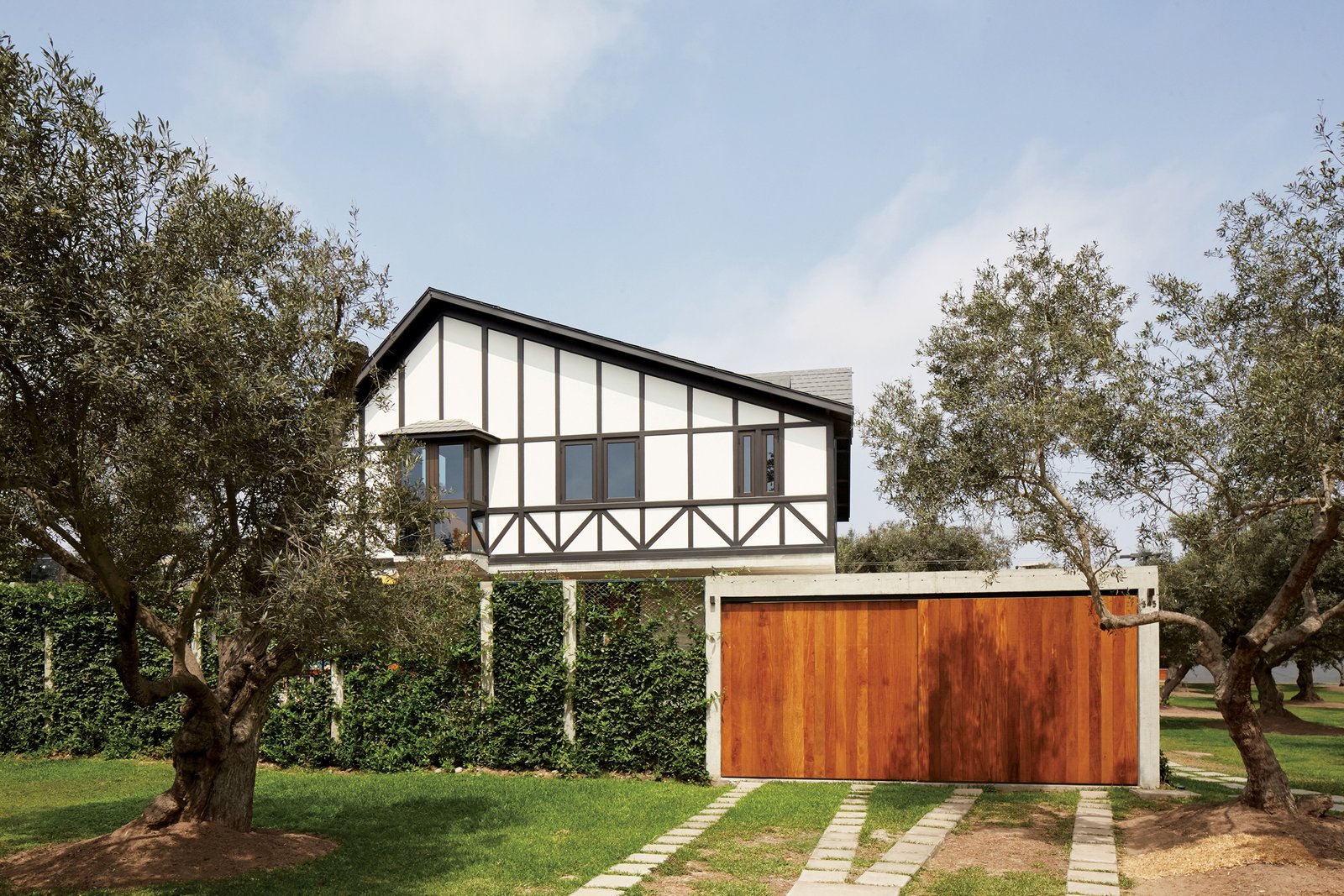 The front, street-side view of the home reveals little about its true design.