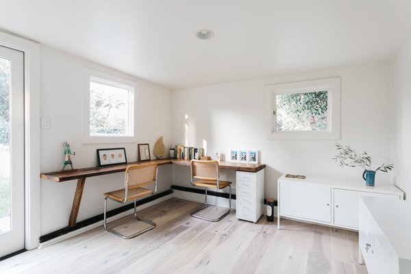 The guest house also features a quiet work area, complete with a custom-built, L-shaped desk.