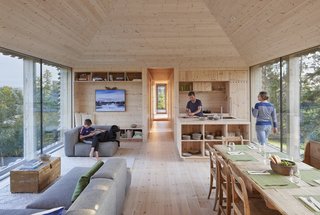 Twenty-foot sliders flank the living/dining area, providing spectacular views in both directions. The painting is by Randi Mork-Ulnes, Casper’s mother.