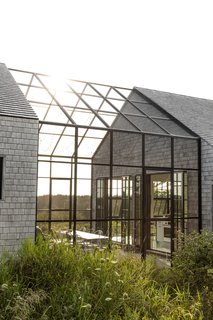 “The design for the house emerged from walking the property. We imagined that as we climbed up from the beach, we’d see little peeks of our home from behind the trees,” says Brad Horn, architect and resident.