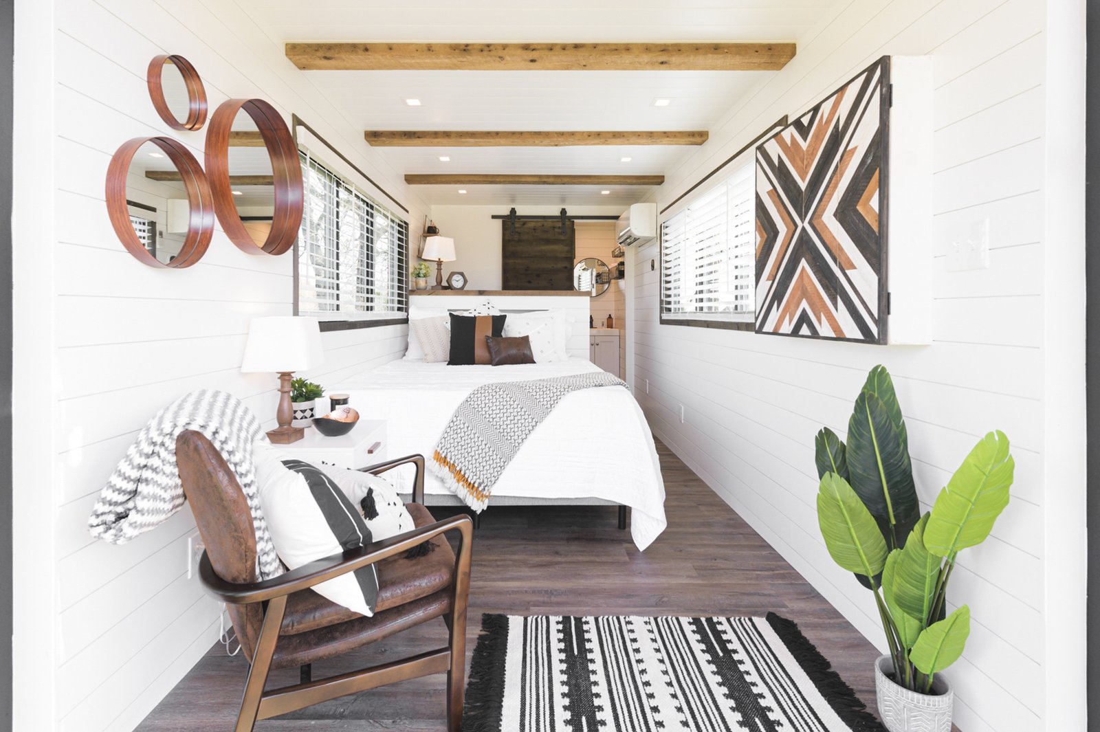 The interior is more suited for guest accommodations, prioritizing more space for the bed and bathroom and opting to remove the living area.