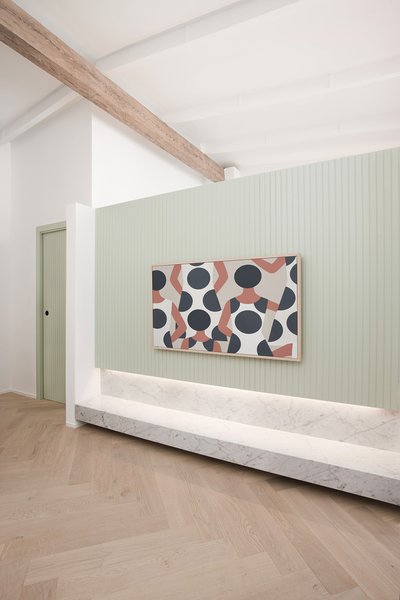 A Frame TV by Samsung displays a digital image of a McFetridge painting.