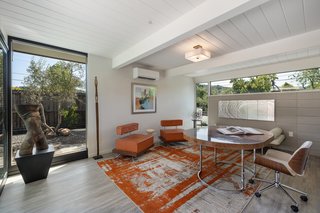 Office, Study Room Type, Vinyl Floor, Chair, and Desk The home office is brightened by glass on three sides. All new energy-efficient windows have been installed throughout the home.