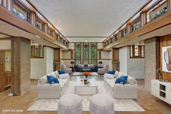 The current owners purchased the property in the early '80s and proceeded to reverse decades of haphazard alterations with the help of restoration architect John Vinci. Once the auditorium, a grand living area features reproductions of Wright's iconic "kinder-symphony" windows, the originals having been removed and sold to museums by previous owners.