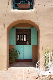 An original doorway is now a window to pass items through from the kitchen.