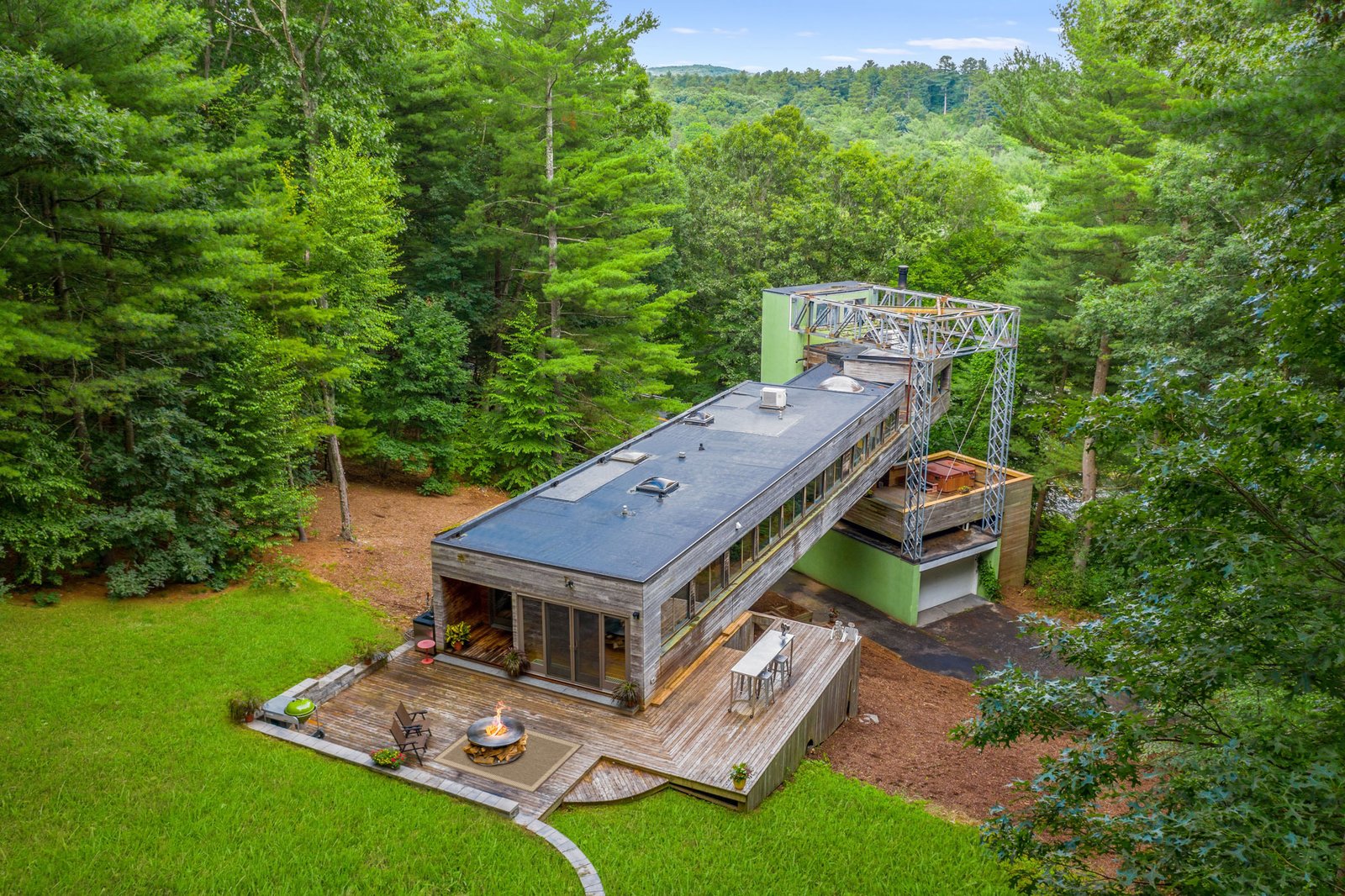 Photo 2 of 17 in A Bridge-Like Home Suspended Above a Connecticut