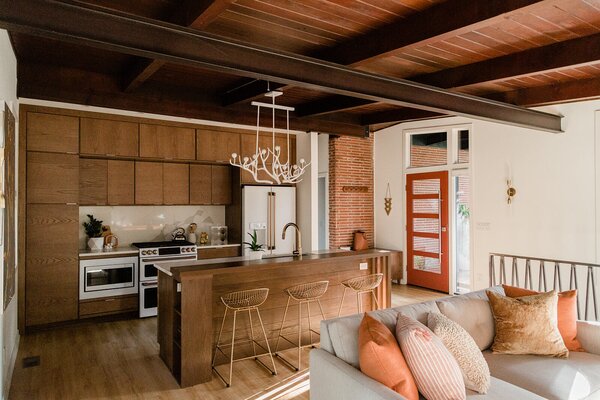 The home's biggest changes came in the living area and kitchen—now a single open space after removing several walls and relocating the basement stairwell.