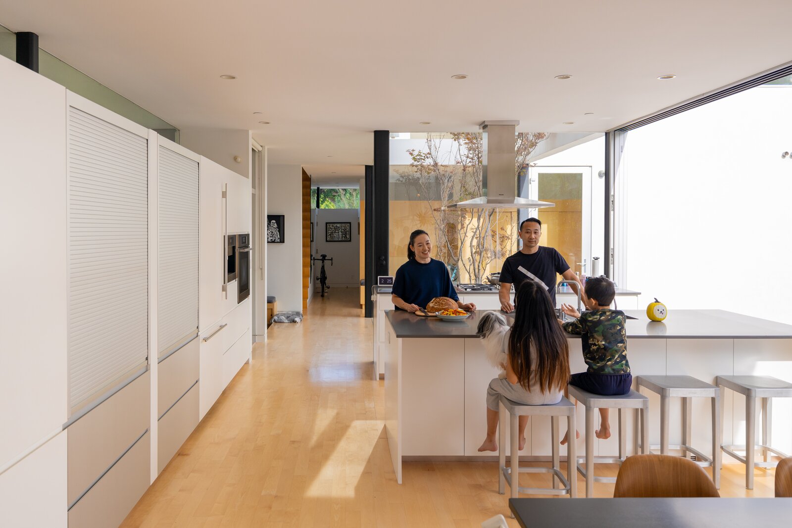Pocket doors lend an openness to the space that complements the Lai family’s lifestyle.