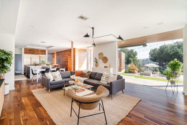 As part of the recent revamp, the owners took down the wall in the kitchen to create seamless flow with the family room. Sliding glass doors offer instant connection with the backyard.