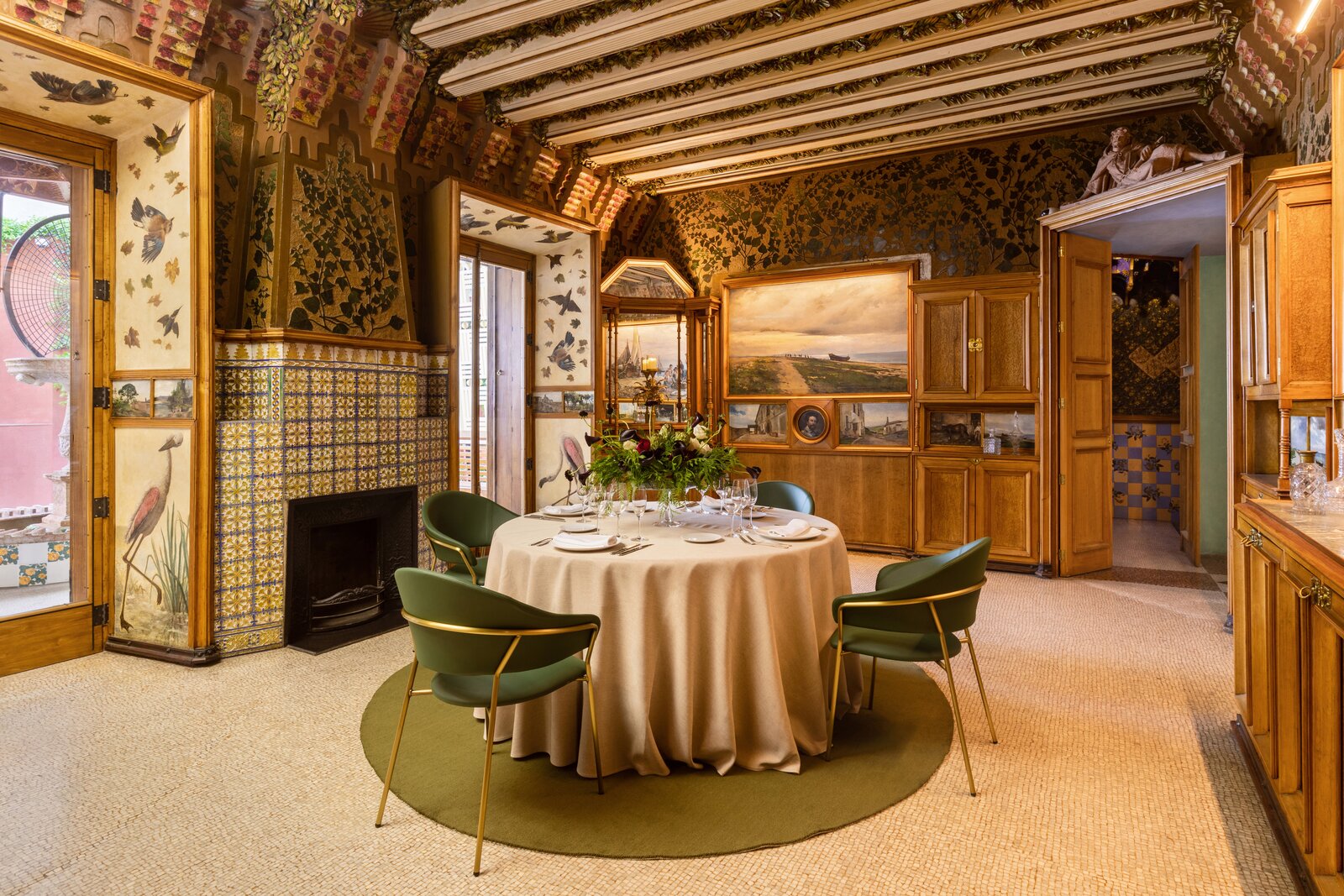 A peek at the dining room where guests will enjoy a Gaudí–inspired Michelin star meal. Much of the wooden furniture in this room was designed by the internationally renowned architect.