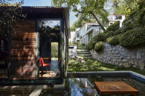 The Jean Prouvé–designed prefab is tucked away in the backyard, set between two koi ponds.