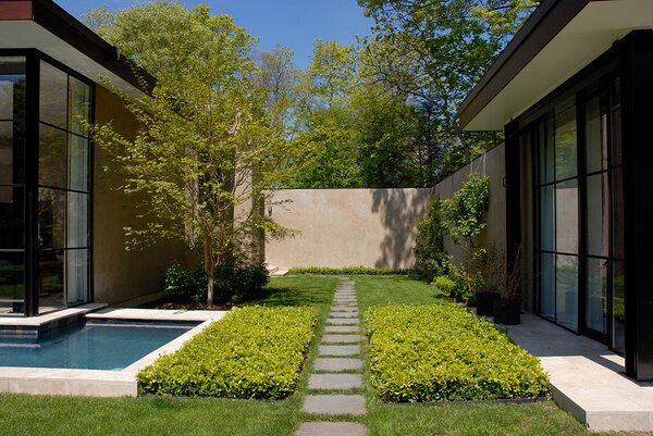Lush landscaping dots the tucked-away, one-acre lot, offering a manicured East Hampton oasis.