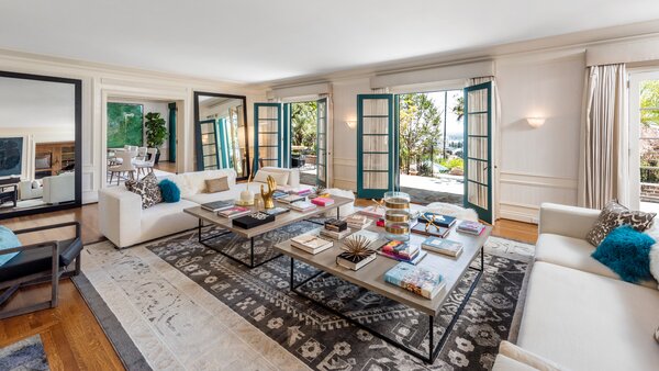 Inside, the home is fitted with a neutral palette, offering a calming environment to gather. The spaciousness of the primary living areas lend to both small- and large-scale entertaining.