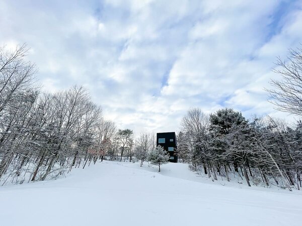 The home sets on two acres of wooded land, and offers spectacular sunrises, especially in winter.