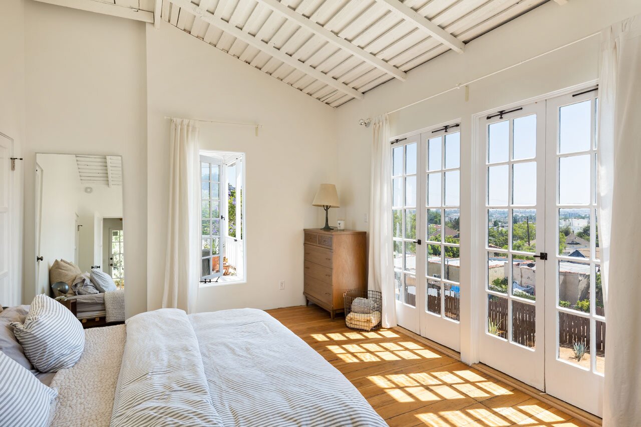 Take advantage of a spectacular view and position your bed to face a wall of French doors.