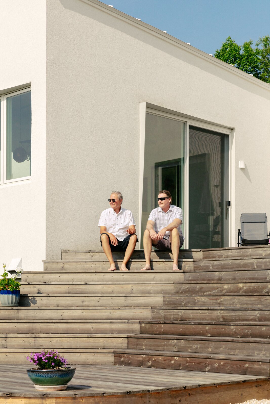 James D. Faubion and William R. Duell soak in the sun and admire the view from the deck, which the anthropologist and playwright plan to use for readings.