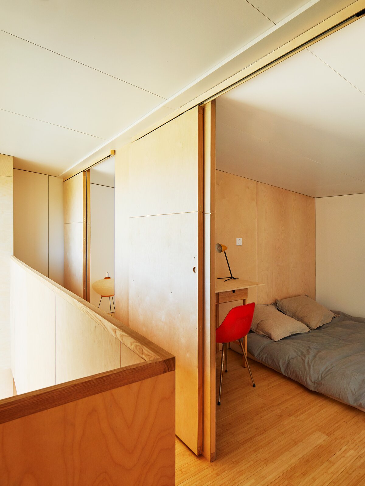 Upstairs, three small bedrooms share a bathroom.