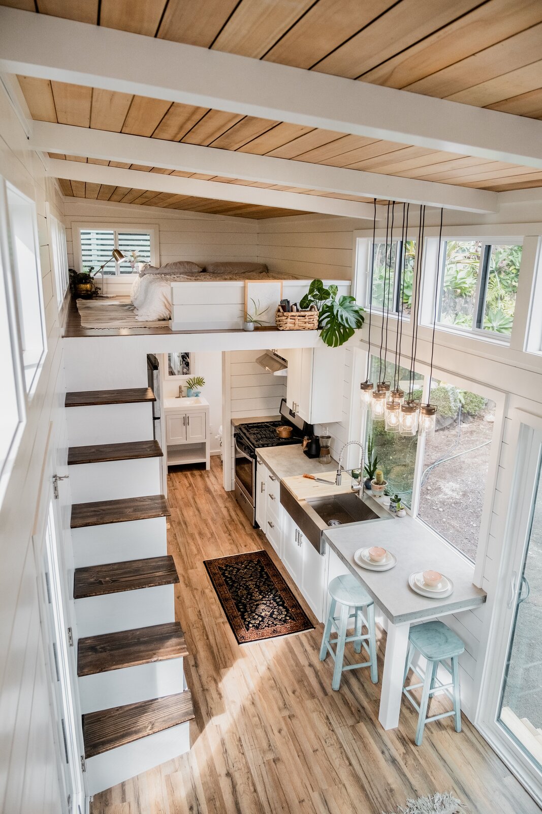 The interior features two lofts: an 8'x10' platform with the main bed and a 8'x4' area often used for reflective recreation.