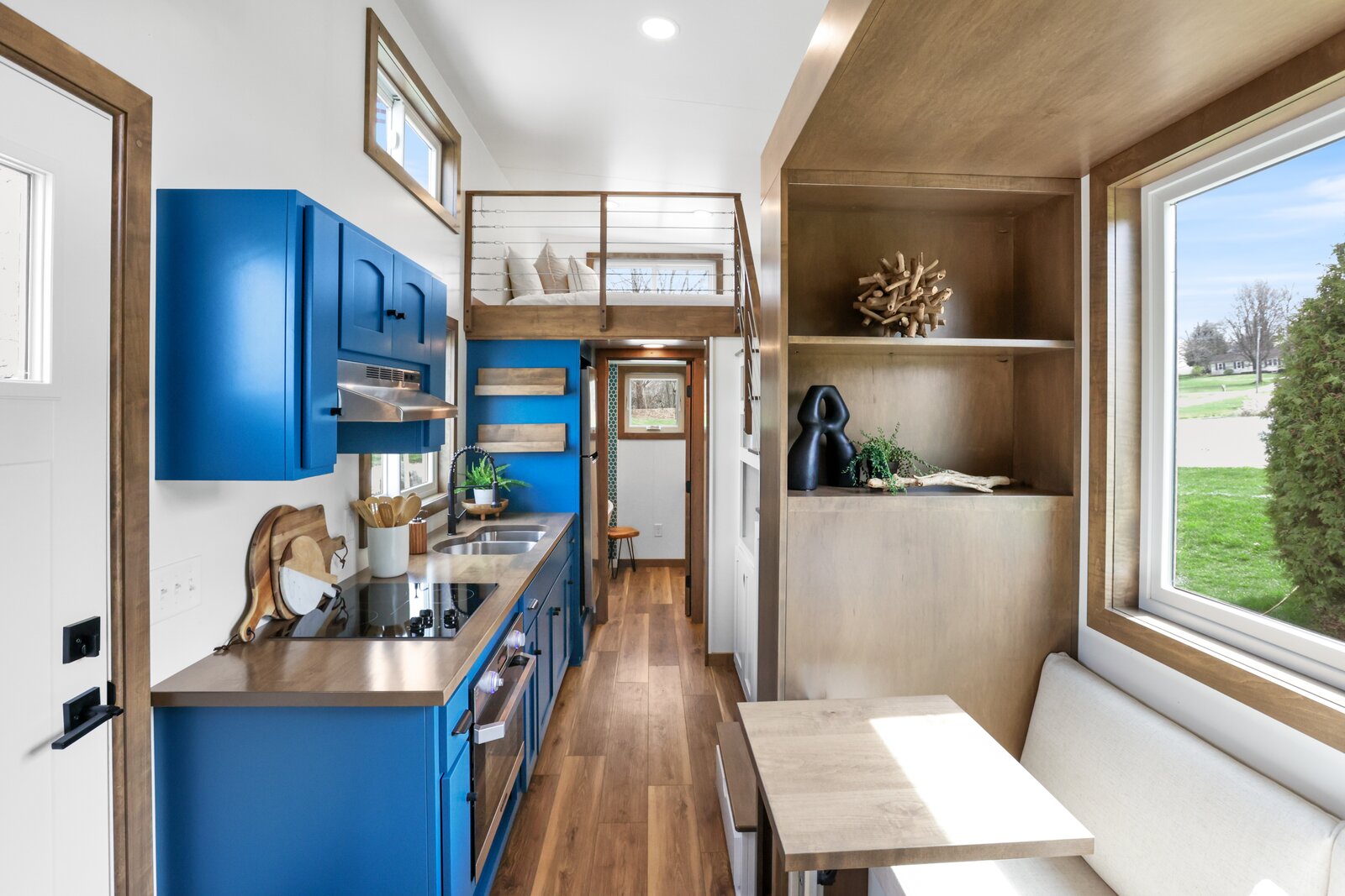 Because of the limited space, all the furnishings and millwork were made specifically for the home. Using engineered materials like vinyl flooring and maple plywood for the walls helped to cut down on costs.