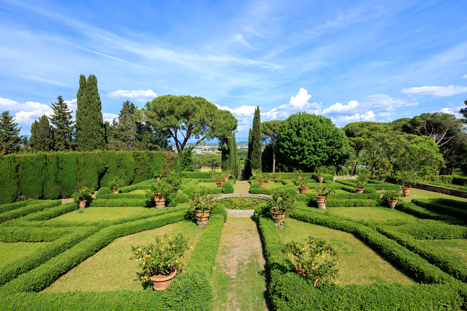 The garden and symmetrical flowerbeds were designed by English architect Cecil Pinsent.