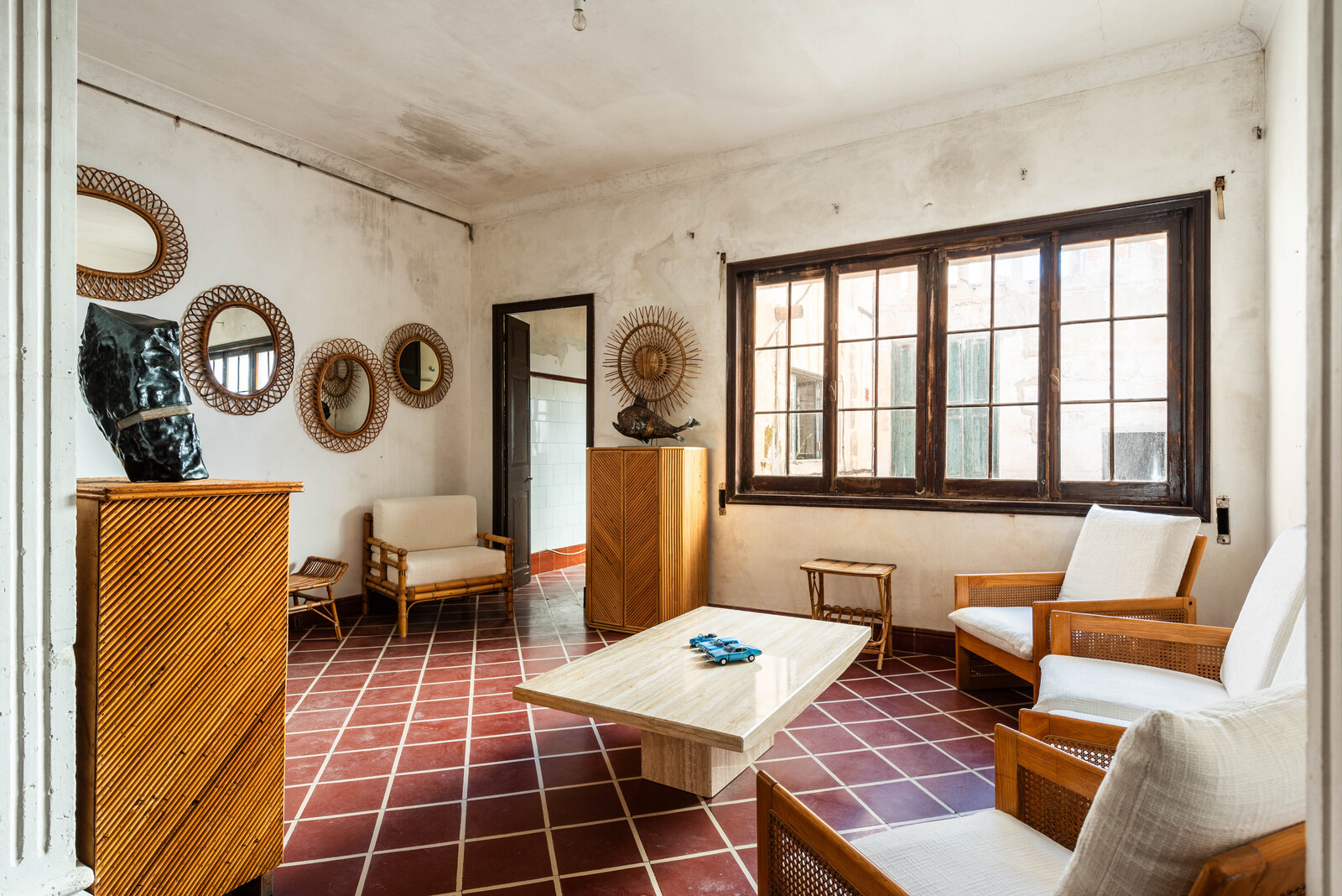 Large pictures windows overlooking the courtyard usher in an abundance of natural light.