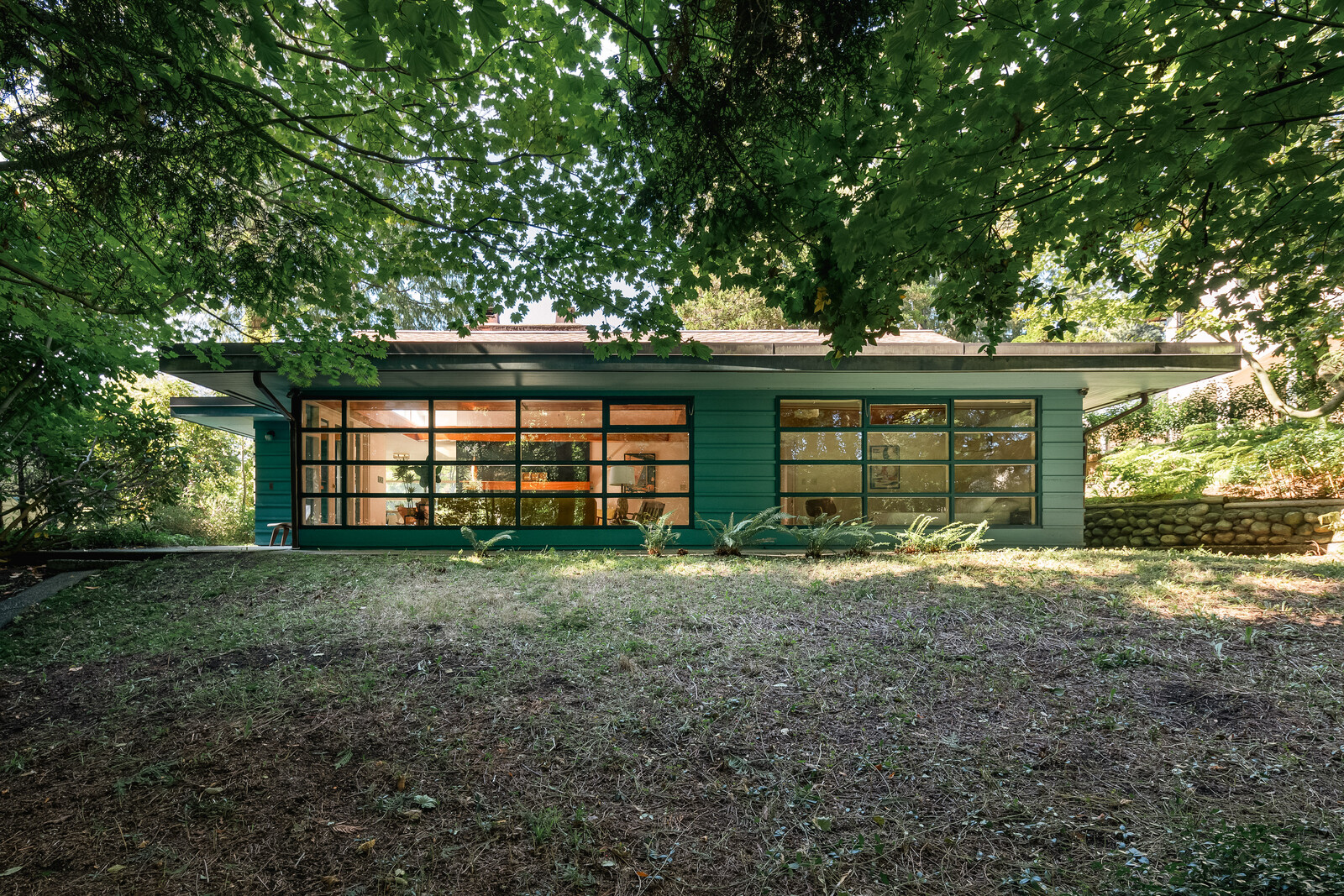 Architect Fred Hollingsworth designed this woodsy residence, which was built in 1950 and has been owned by the same family ever since.