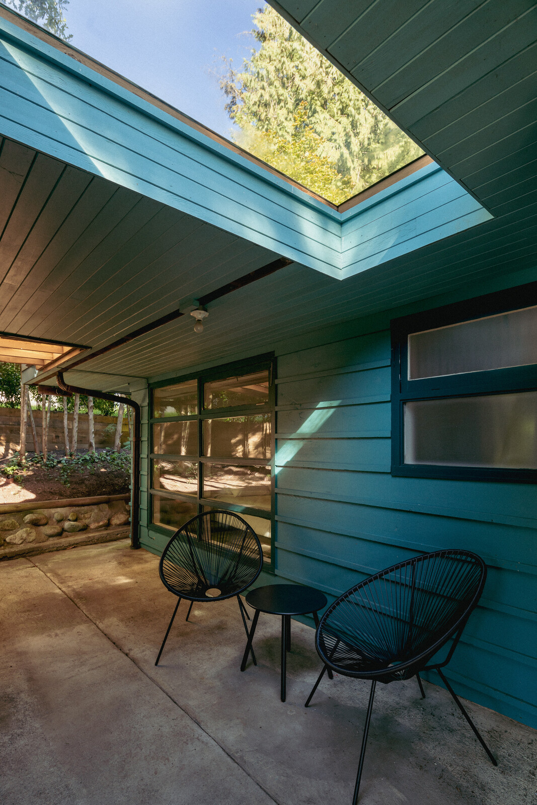 A partially covered patio presents a private sanctuary to reconnect with nature.