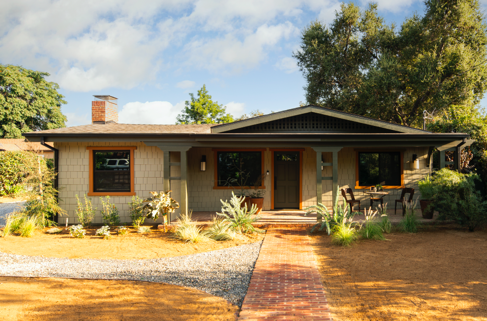 The historic primary residence dates back to 1923 and features a large front covered patio.
