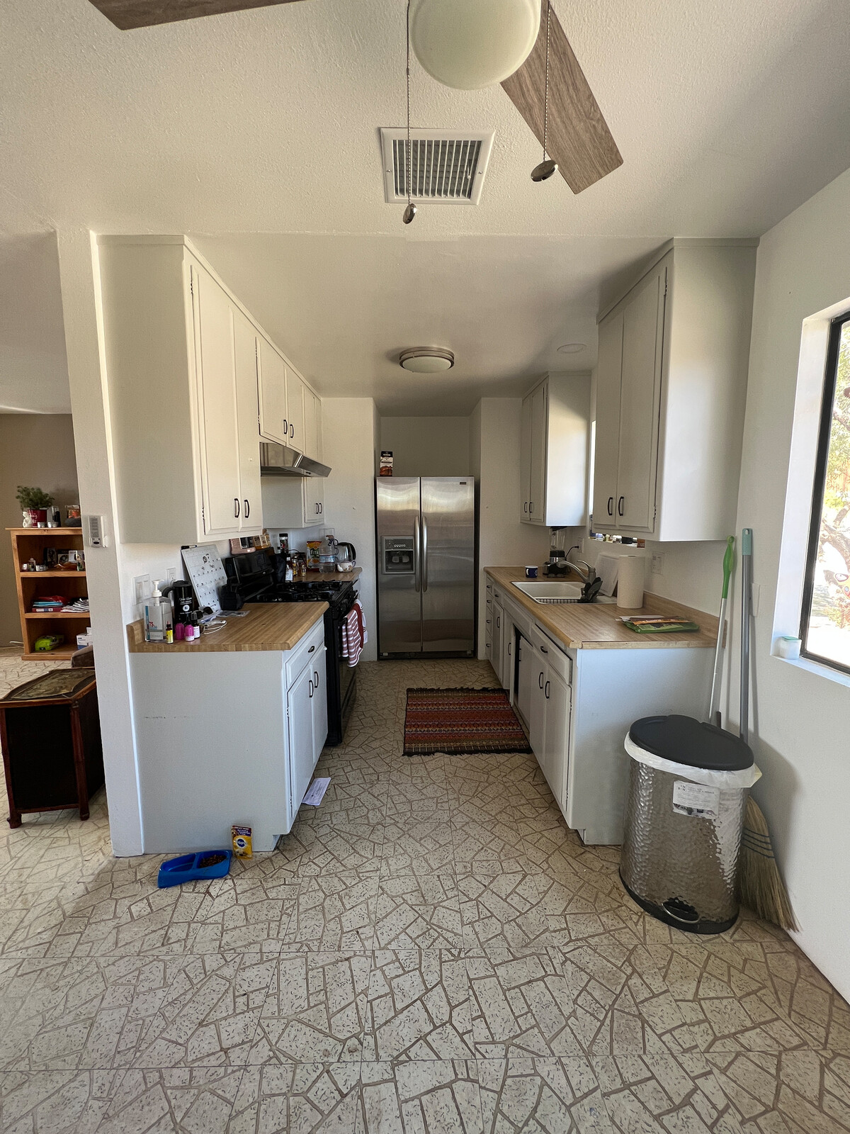 Before: The narrow galley kitchen was cut off from the living room area and felt cramped.