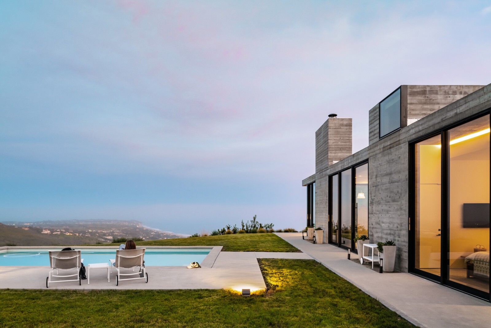 When the house architect Lorcan O’Herlihy originally built for his parents burnt down in a Malibu wildfire, he was given the opportunity to rebuild it as a structure that will stand the test of time. The concrete shell of the house was the biggest fireproofing decision, particularly the roof. The house also features additional passive fire protection elements to prevent ember intrusions, such as spark-arresting screens to protect any vulnerable spots and drought-tolerant landscaping. A sprinkler system wraps the perimeter to saturate the building in an emergency, plus there’s a pool that could provide additional water for firefighting purposes.