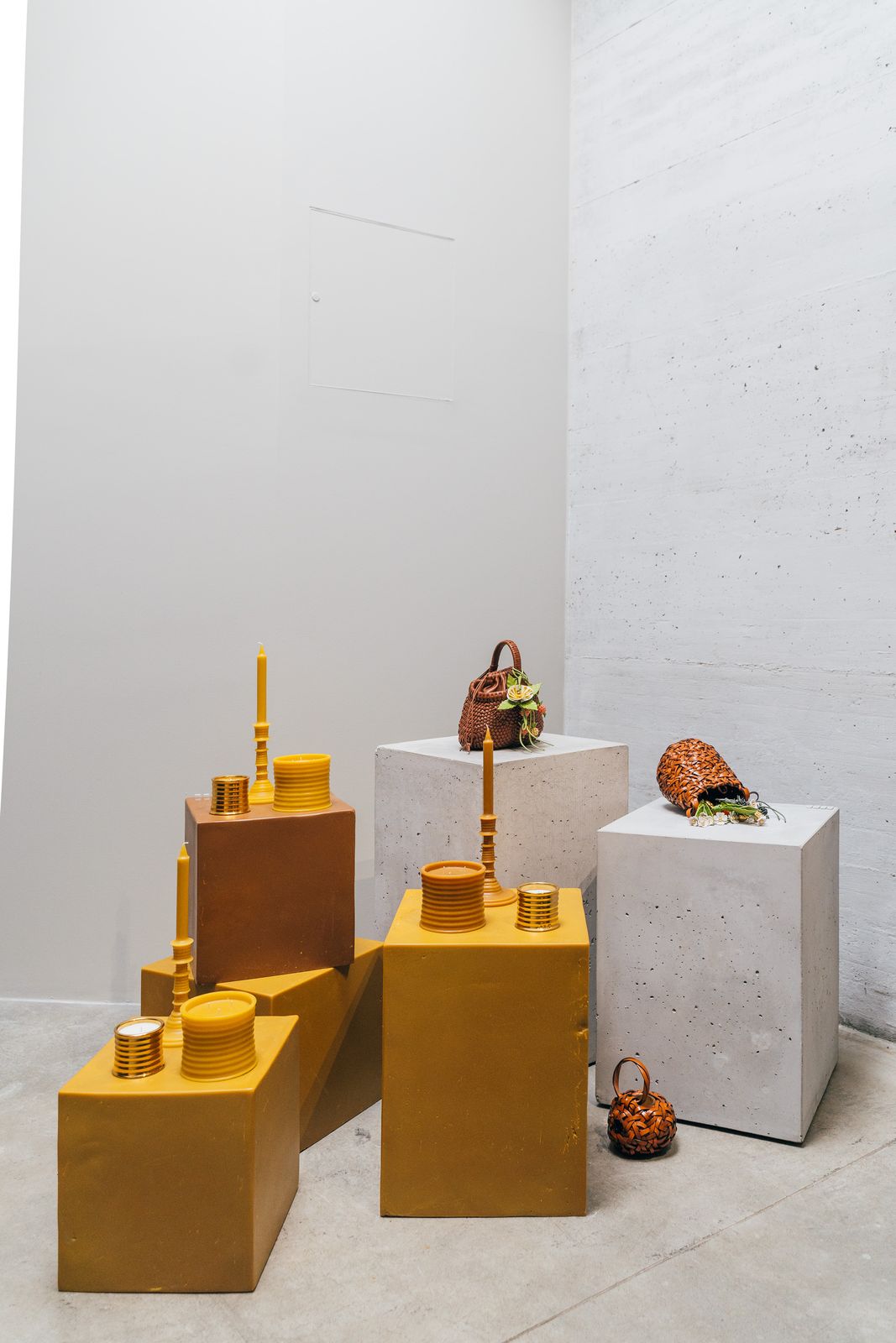 Contrasting the dark underground space, a series of plinths highlighting homewares from bag charms to candles were cast in bright light.