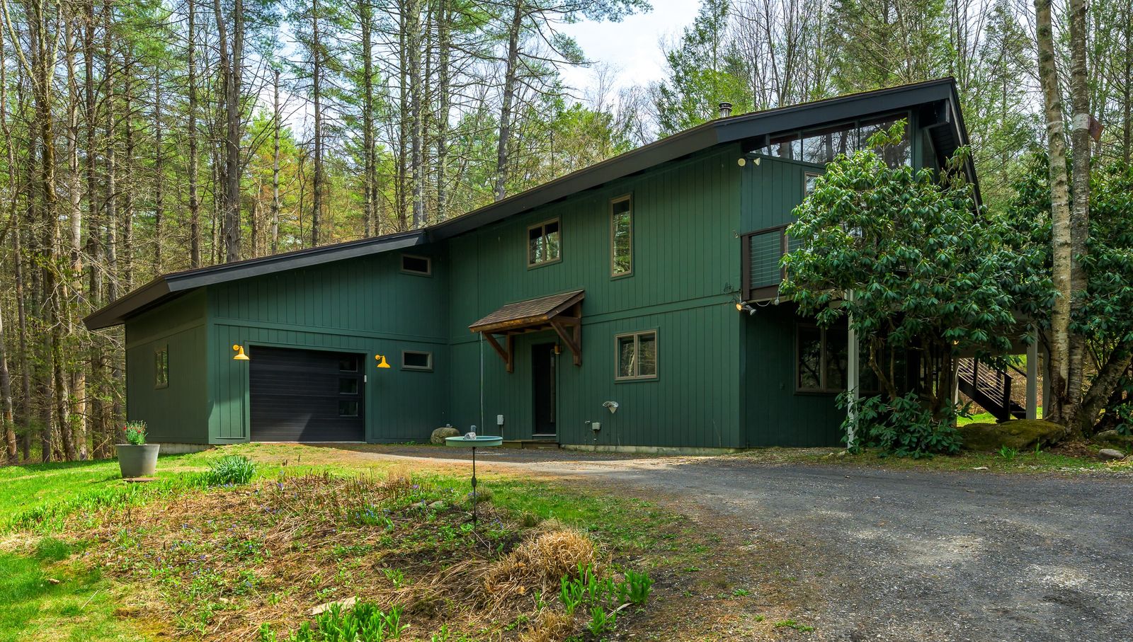 Set a stone’s throw away from several natural parks, the updated ’70s home has a new kitchen, a woodburning stove, and a prefab guesthouse.