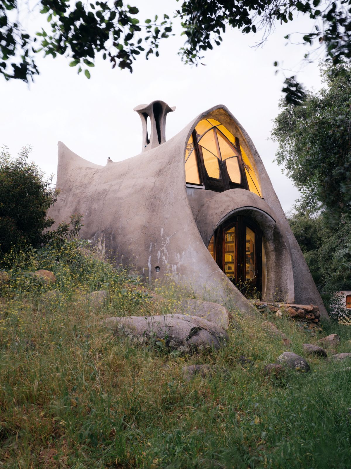 Designed James Hubbell, this curvaceous gunite home is packed with whimsical details, and it was hand built by a single family over the course of four years.